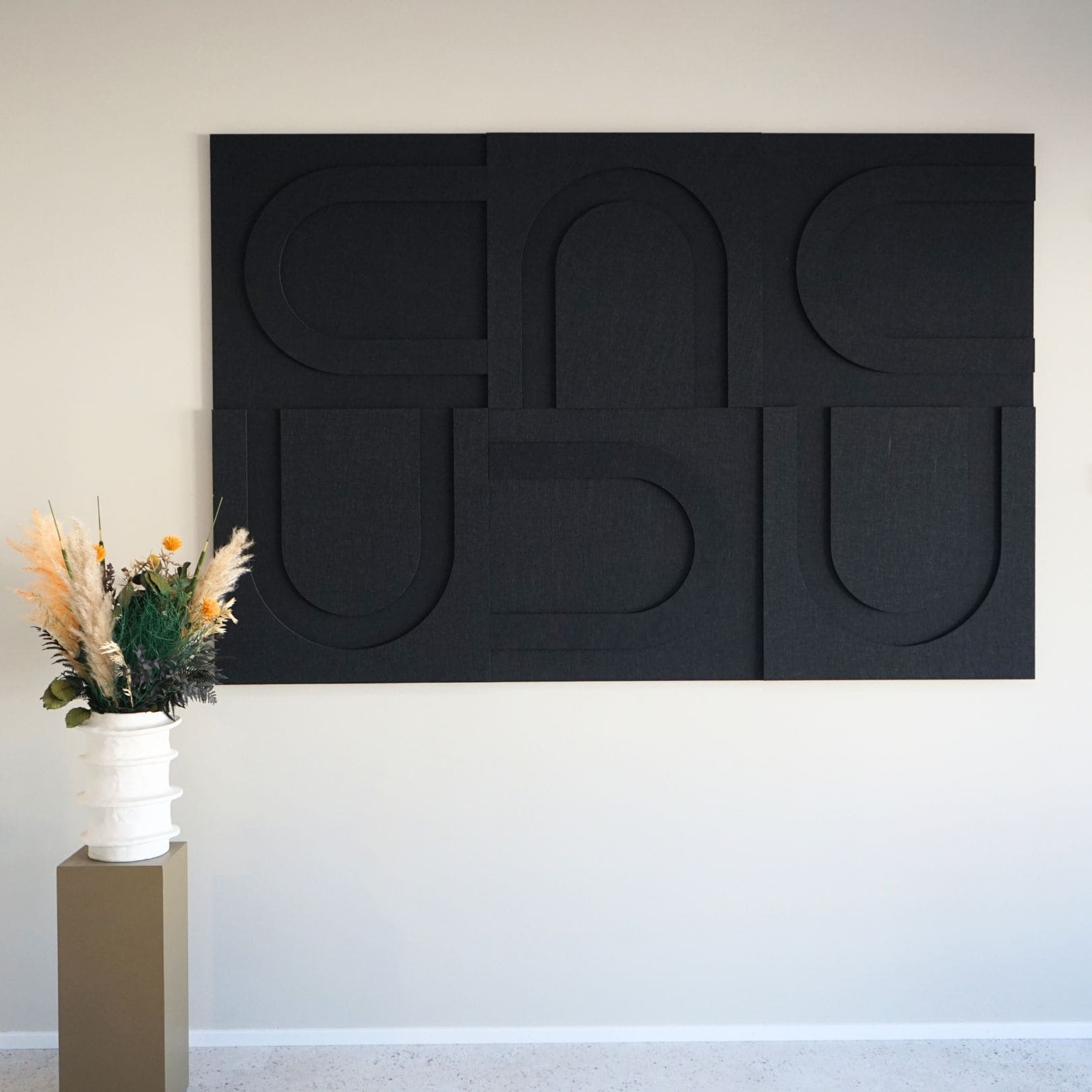 Black geometric soundproof wall art panels from Arturel, enhancing acoustic quality in modern interiors.