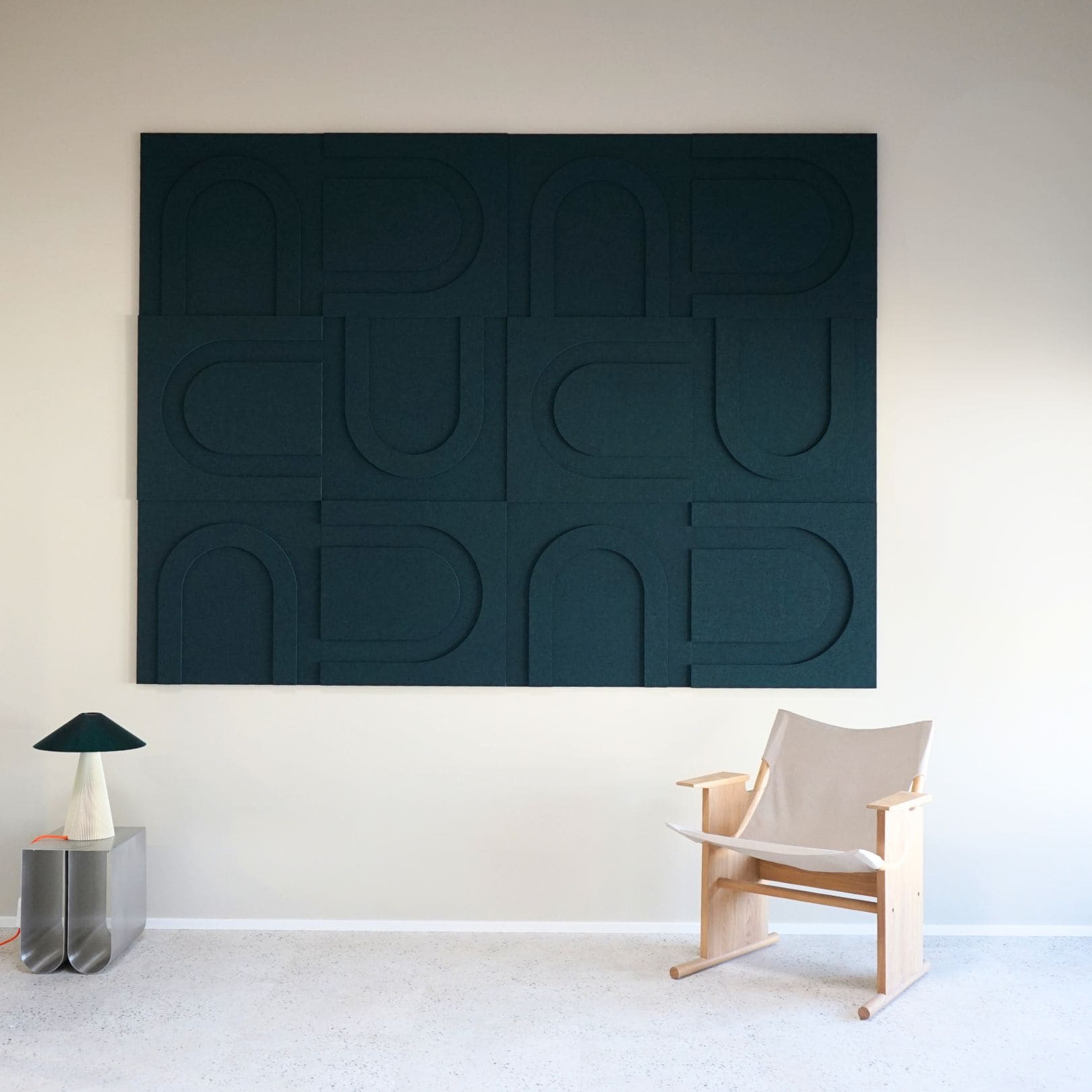 Dark green geometric wall panels from Arturel, designed for sound absorption and modern interior styling.